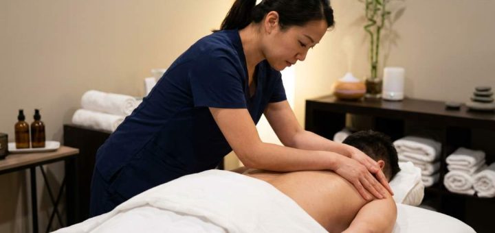 Professional Asian deep tissue massage session in Houston TX wellness spa environment